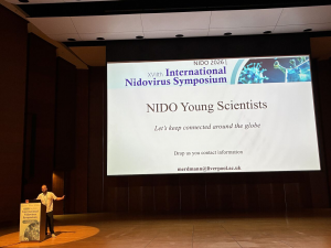 Max on stage announcing NIDO young scientists launching. 